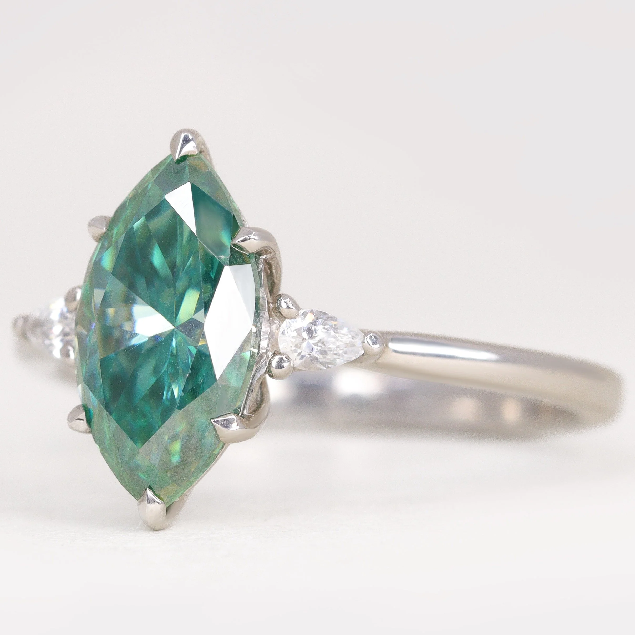 Elspeth - Marquise Cut Teal Moissanite and Diamond Trilogy Made-to-Order Engagement Ring - Image 3