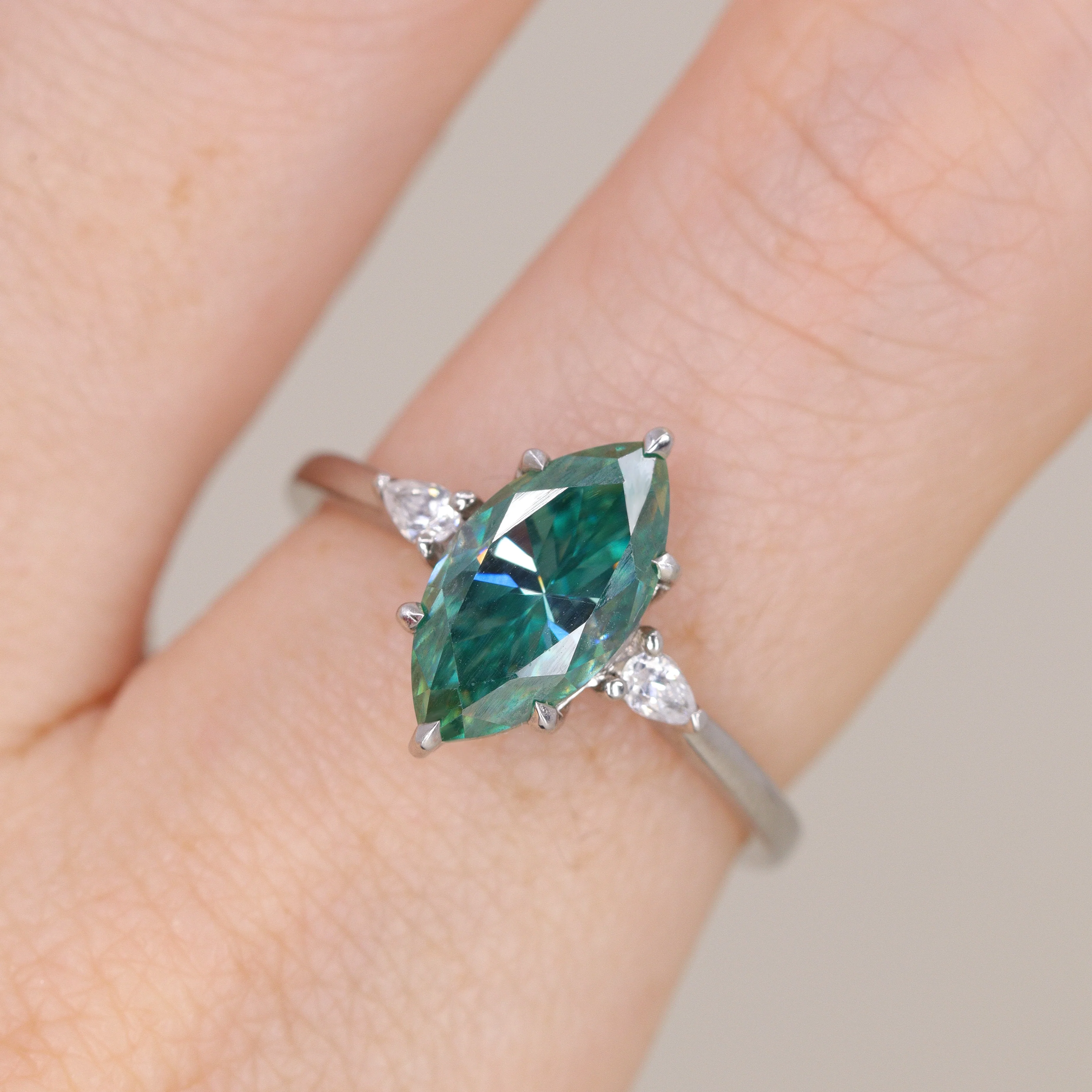 Elspeth - Marquise Cut Teal Moissanite and Diamond Trilogy Made-to-Order Engagement Ring - Image 4