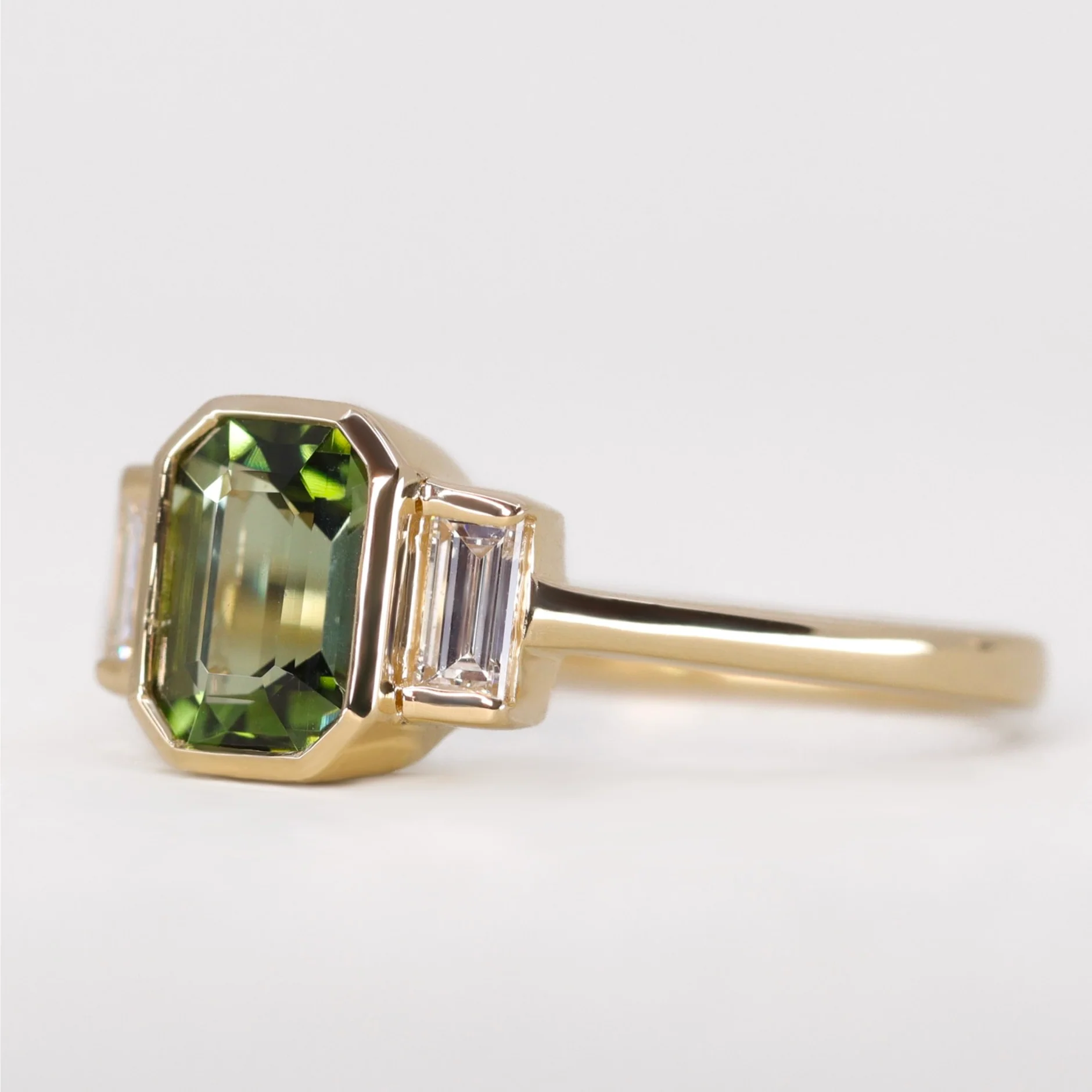 Phoebe - Emerald Cut Green Tourmaline Trilogy Engagement Ring - Ready-to-Wear - Image 3